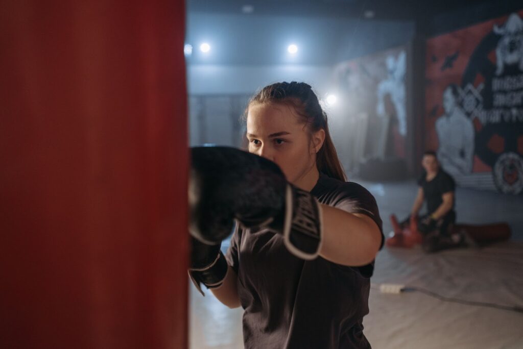 girl boxing training with mouth guard